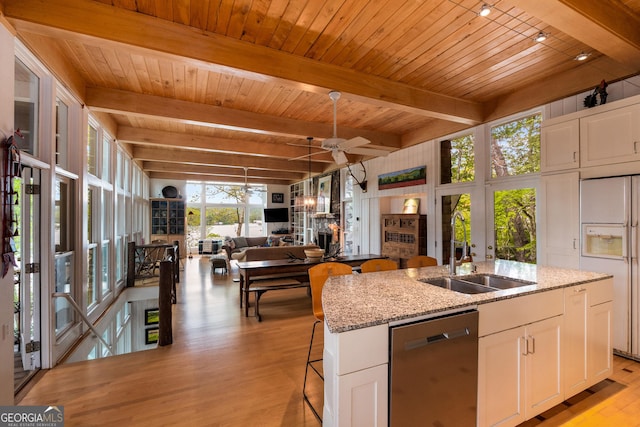 1006 Perrin Cove Rd, Tiger, GA 30576 - kitchen featuring dishwasher, white fridge with ice dispenser, an island with sink, ceiling fan, and light wood-style flooring