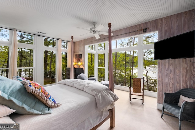 1006 Perrin Cove Rd, Tiger, GA 30576 - bedroom with wooden walls, multiple windows, and light colored carpet