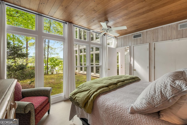 1006 Perrin Cove Rd, Tiger, GA 30576 - carpeted bedroom with wooden ceiling, multiple windows, and wood walls