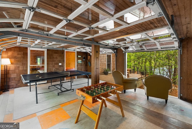 1006 Perrin Cove Rd, Tiger, GA 30576 - game room featuring concrete block wall and light wood-style floors