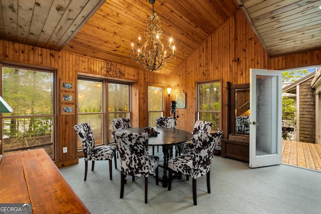 1006 Perrin Cove Rd, Tiger, GA 30576 - dining area with wooden walls, vaulted ceiling, light colored carpet, a chandelier, and wood ceiling