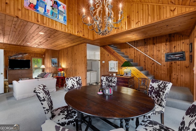 1006 Perrin Cove Rd, Tiger, GA 30576 - dining room featuring carpet, wood walls, a chandelier, stairs, and wood ceiling