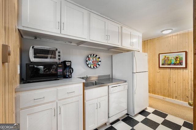 1006 Perrin Cove Rd, Tiger, GA 30576 - kitchen featuring white appliances, light flooring, wood walls, white cabinetry, and light countertops