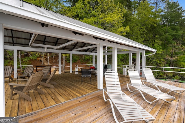 1006 Perrin Cove Rd, Tiger, GA 30576 - wooden deck with a gazebo, outdoor dining area, and view of wooded area