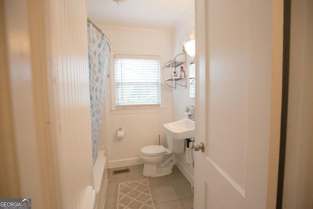 full bathroom with tile patterned flooring, toilet, shower / tub combo, visible vents, and ornamental molding
