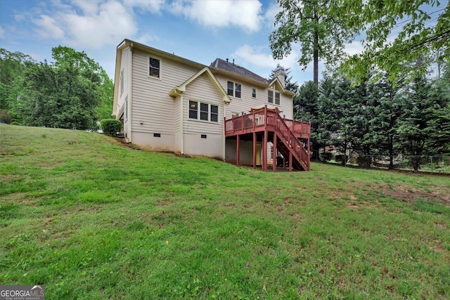 rear view of property featuring stairway, a lawn, crawl space, and a wooden deck
