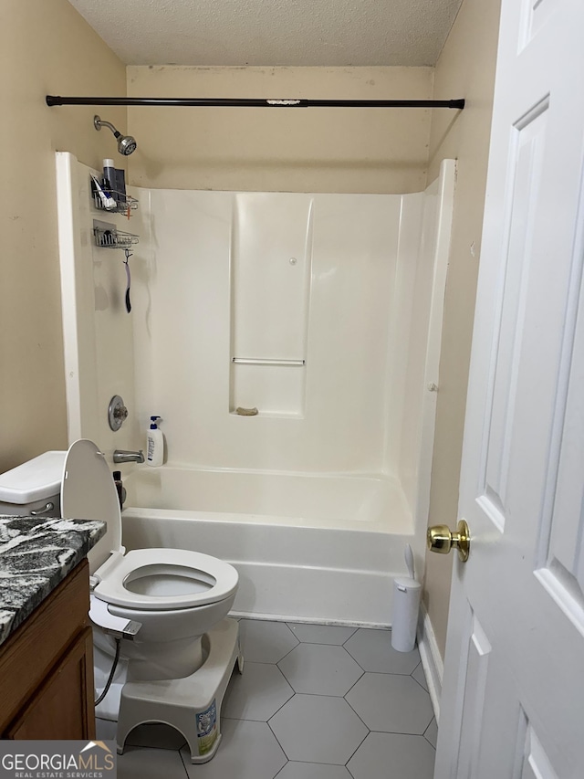 bathroom featuring shower / bathtub combination, toilet, a textured ceiling, and vanity