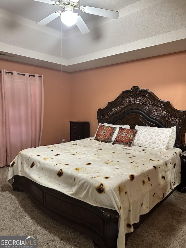 bedroom featuring visible vents, carpet, and ceiling fan