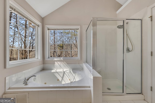 full bath with a jetted tub, a stall shower, and lofted ceiling