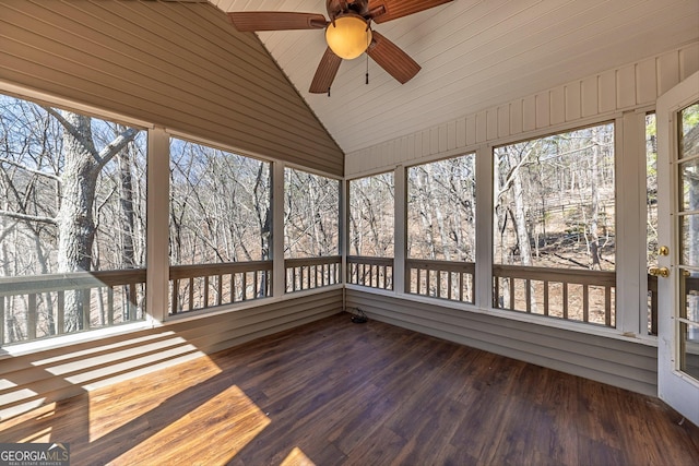 unfurnished sunroom with ceiling fan