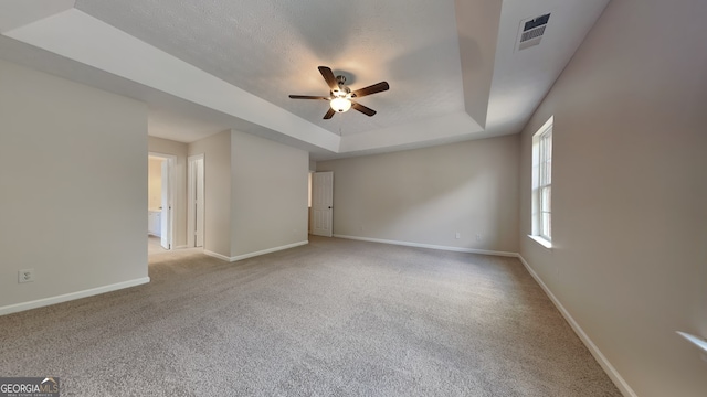 8256 Milam Loop, Fairburn, GA 30213 - empty room with baseboards, ceiling fan, carpet flooring, and a raised ceiling