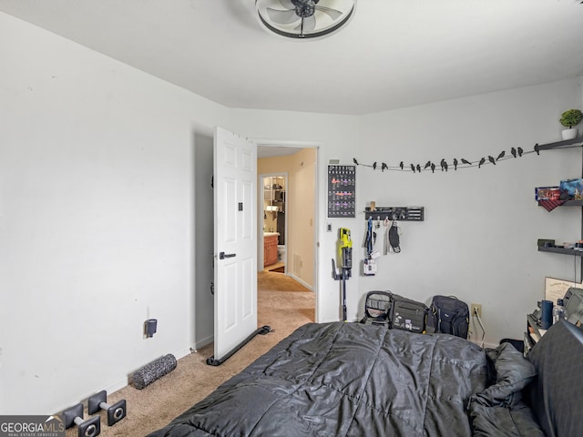 carpeted bedroom featuring baseboards