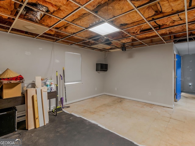 finished basement featuring baseboards