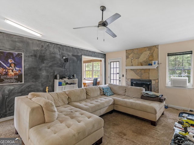 living room with ceiling fan, a fireplace, cooling unit, lofted ceiling, and carpet