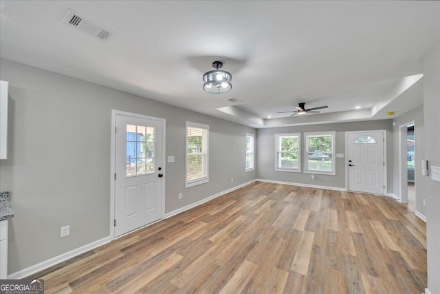 327 Peach Cir, Fort Valley, GA 31030 - entryway with light wood finished floors, a tray ceiling, a ceiling fan, and recessed lighting
