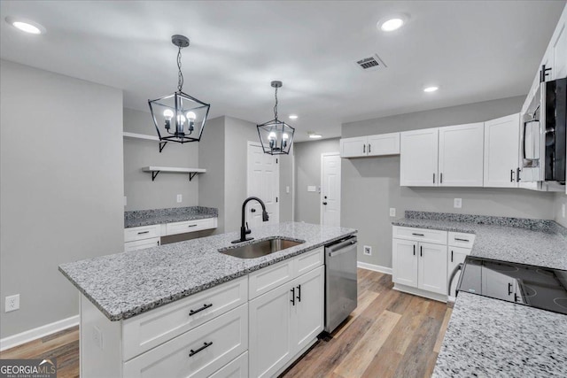 327 Peach Cir, Fort Valley, GA 31030 - kitchen featuring appliances with stainless steel finishes, a chandelier, white cabinetry, open shelves, and recessed lighting