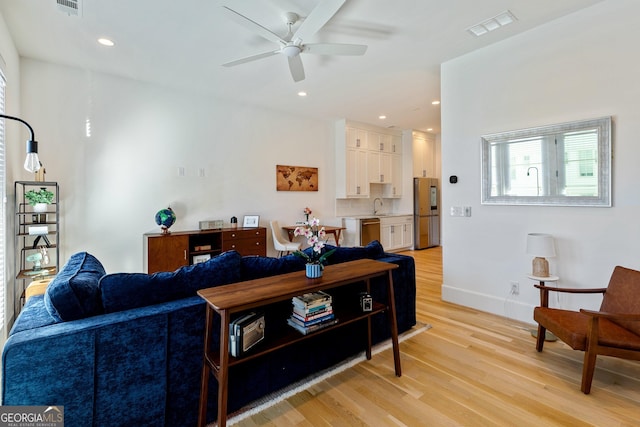 686 Exchange St SE, Atlanta, GA 30315 - living area with visible vents, a ceiling fan, light wood finished floors, and recessed lighting