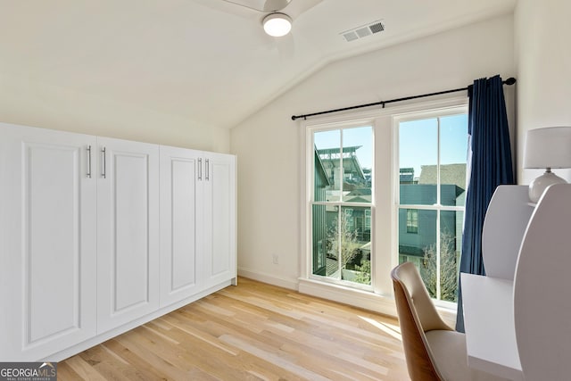 686 Exchange St SE, Atlanta, GA 30315 - interior space with visible vents, light wood-style floors, baseboards, a ceiling fan, and vaulted ceiling