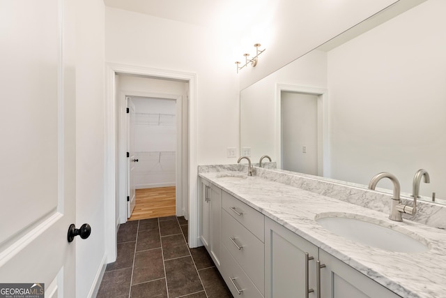 686 Exchange St SE, Atlanta, GA 30315 - full bath featuring a sink, tile patterned flooring, double vanity, and a spacious closet
