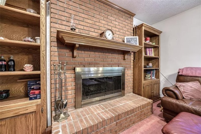 living room with a brick fireplace, a textured ceiling, and carpet flooring