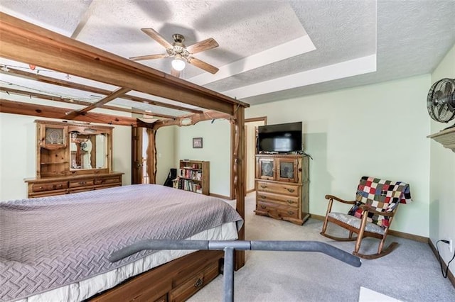 carpeted bedroom with baseboards, a ceiling fan, and a textured ceiling