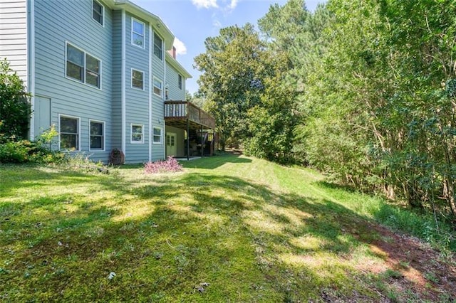 view of yard with stairs and a wooden deck