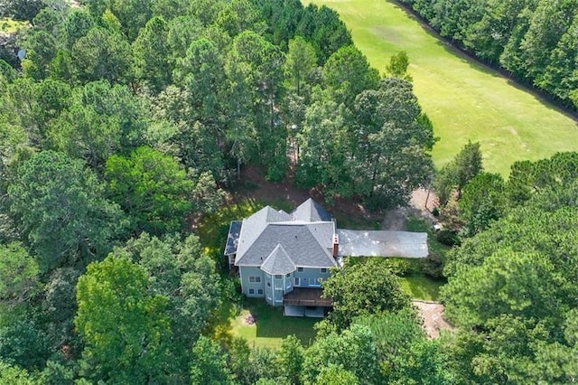 drone / aerial view featuring a forest view