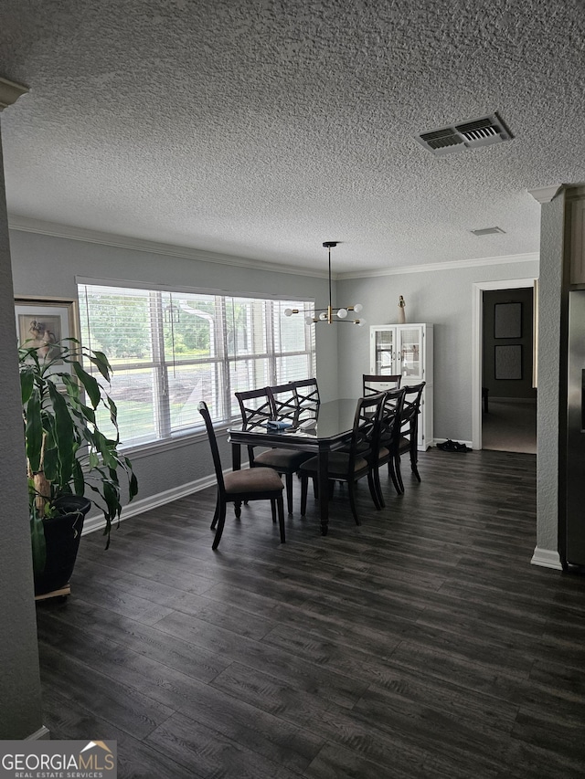 dining room featuring visible vents, ornamental molding, baseboards, dark wood-type flooring, and a textured ceiling