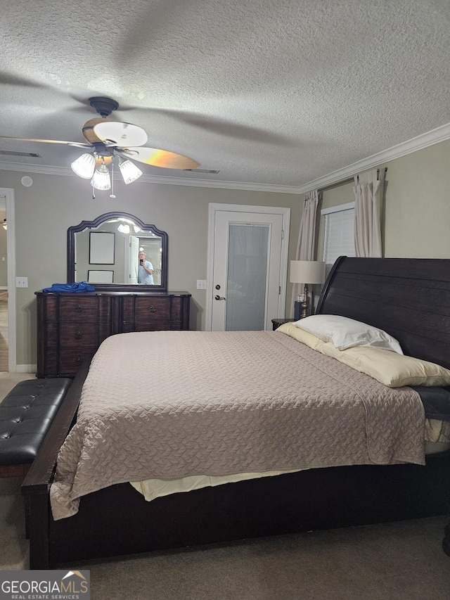 bedroom with crown molding and carpet floors