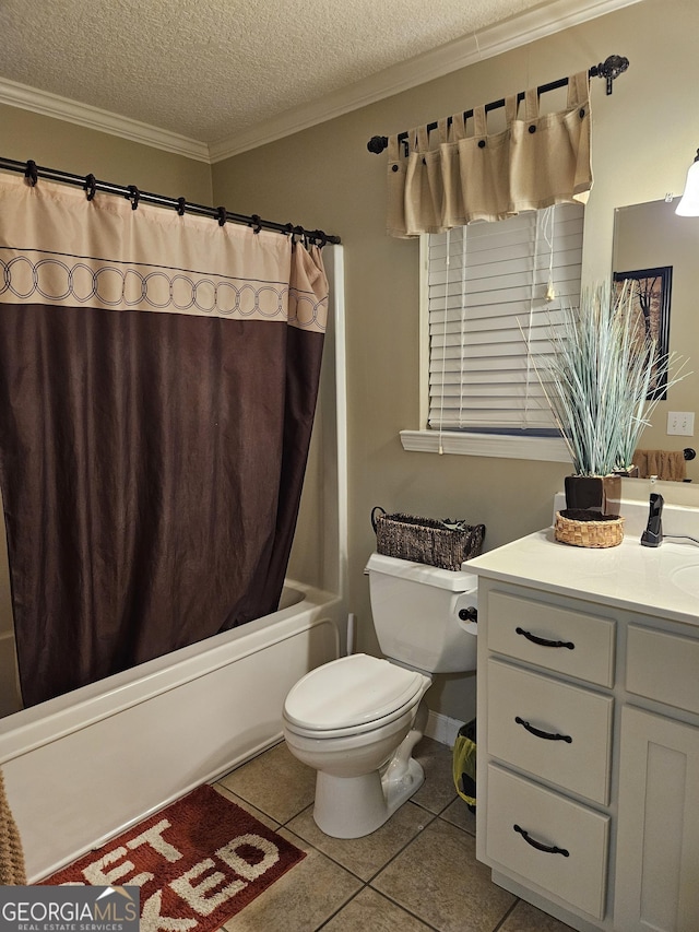 bathroom featuring a textured ceiling, tile patterned flooring, vanity, toilet, and ornamental molding