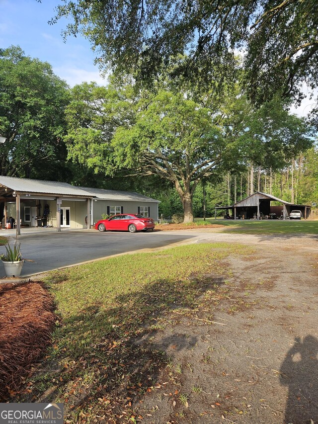 view of road with driveway