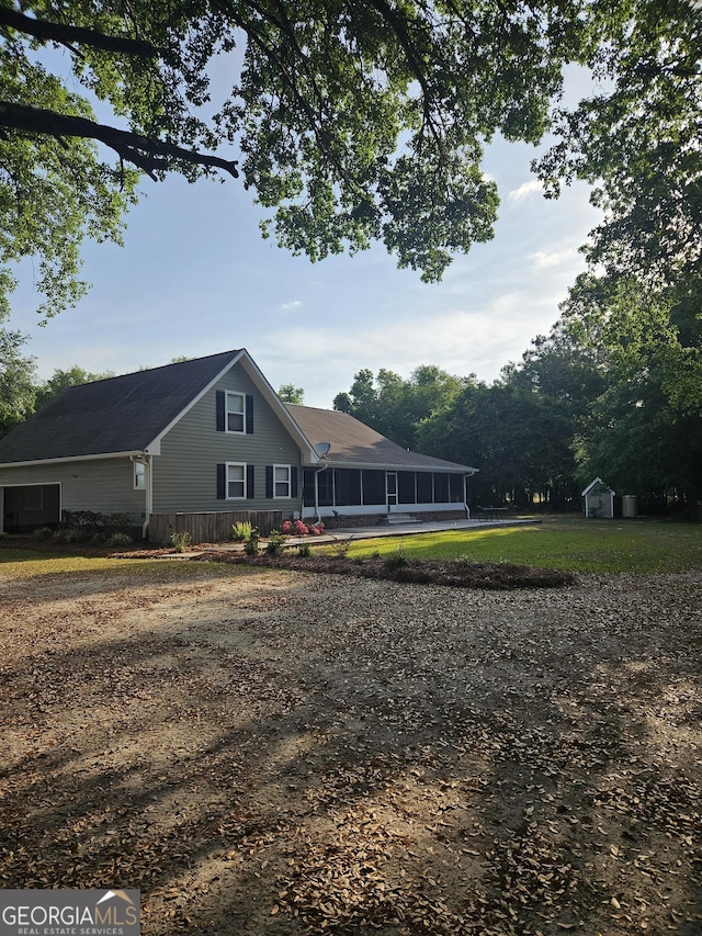 view of front facade with a sunroom