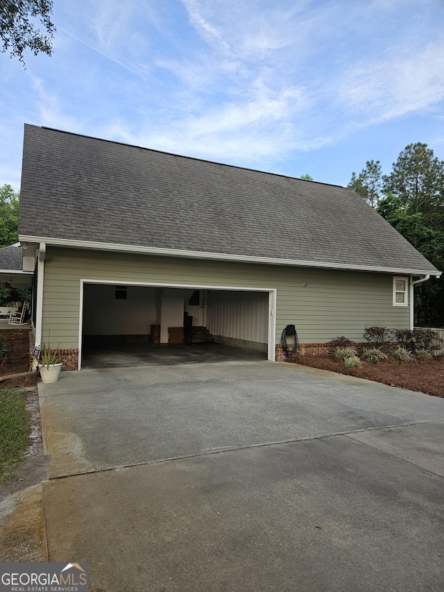 garage with concrete driveway