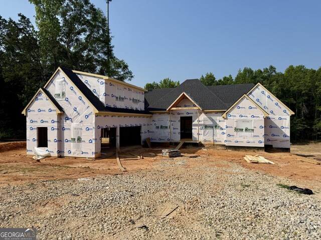 6996 Deaton Henry Rd, Flowery Branch, GA 30542 - unfinished property with stucco siding
