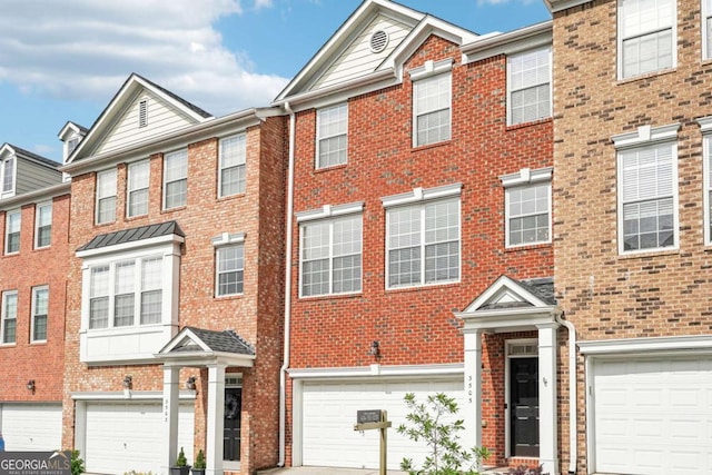 3505 Chattahoochee Summit Ln SE Unit 25, Atlanta, GA 30339 - view of property featuring brick siding, a garage, and driveway