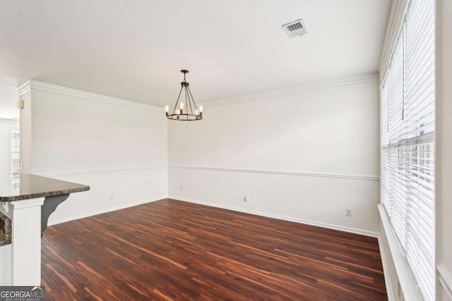 3505 Chattahoochee Summit Ln SE Unit 25, Atlanta, GA 30339 - unfurnished dining area with healthy amount of natural light, dark wood-style flooring, a chandelier, and crown molding