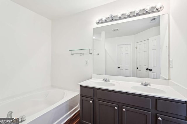 3505 Chattahoochee Summit Ln SE Unit 25, Atlanta, GA 30339 - bathroom with double vanity and a bath