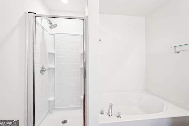 3505 Chattahoochee Summit Ln SE Unit 25, Atlanta, GA 30339 - bathroom with a shower stall and a garden tub