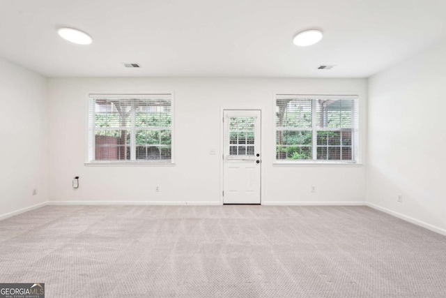 3505 Chattahoochee Summit Ln SE Unit 25, Atlanta, GA 30339 - spare room featuring plenty of natural light and light carpet
