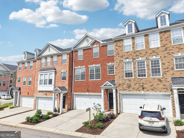 3505 Chattahoochee Summit Ln SE Unit 25, Atlanta, GA 30339 - multi unit property with a garage, brick siding, and driveway