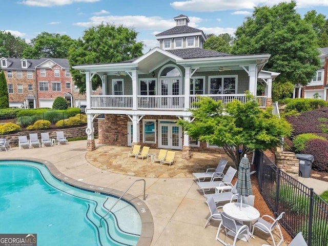3505 Chattahoochee Summit Ln SE Unit 25, Atlanta, GA 30339 - back of house featuring french doors, a patio, a community pool, and a ceiling fan