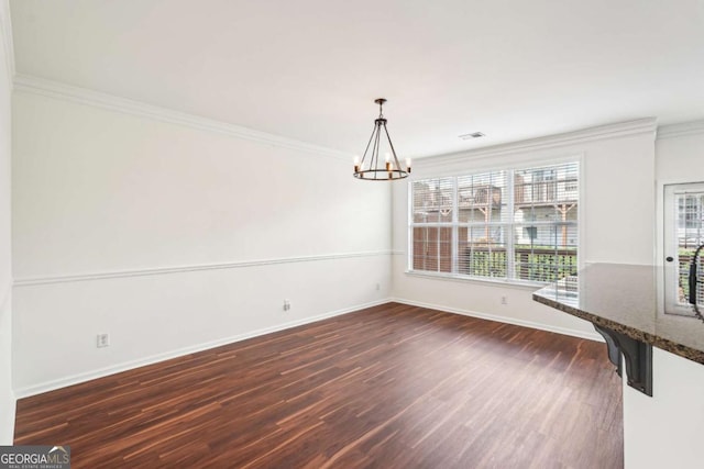 3505 Chattahoochee Summit Ln SE Unit 25, Atlanta, GA 30339 - unfurnished dining area with a chandelier, dark wood finished floors, and ornamental molding