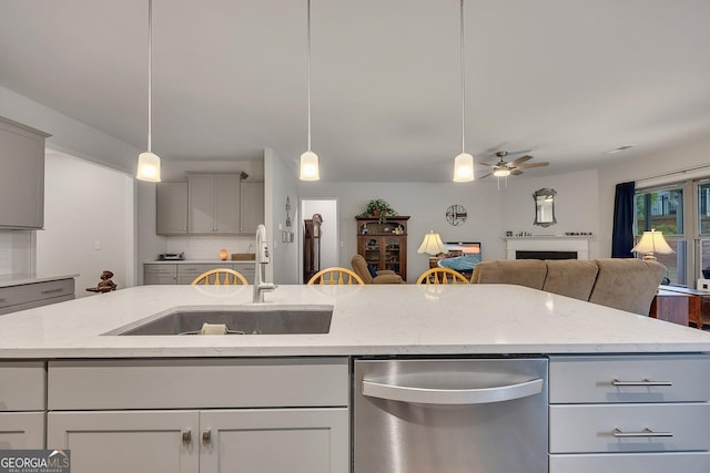 463 Marston Pass, Acworth, GA 30102 - kitchen featuring ceiling fan, light stone counters, a sink, stainless steel dishwasher, and gray cabinetry