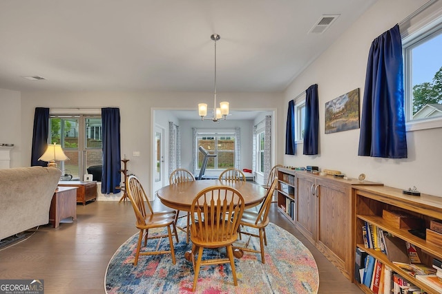 463 Marston Pass, Acworth, GA 30102 - dining room with a notable chandelier, visible vents, a wealth of natural light, and dark wood finished floors