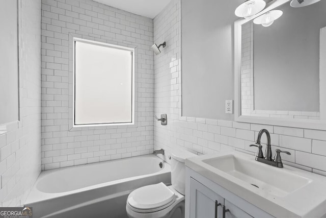 960 Byron Dr SW, Atlanta, GA 30310 - bathroom with tile walls, tasteful backsplash, vanity, toilet, and  shower combination