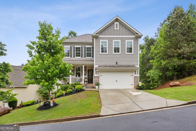 craftsman inspired home with covered porch, concrete driveway, brick siding, and a front lawn