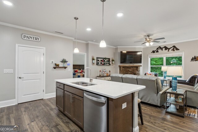 kitchen with dishwasher, a sink, open floor plan, a ceiling fan, and dark wood-style floors