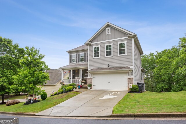 craftsman inspired home featuring board and batten siding, covered porch, brick siding, driveway, and a front lawn