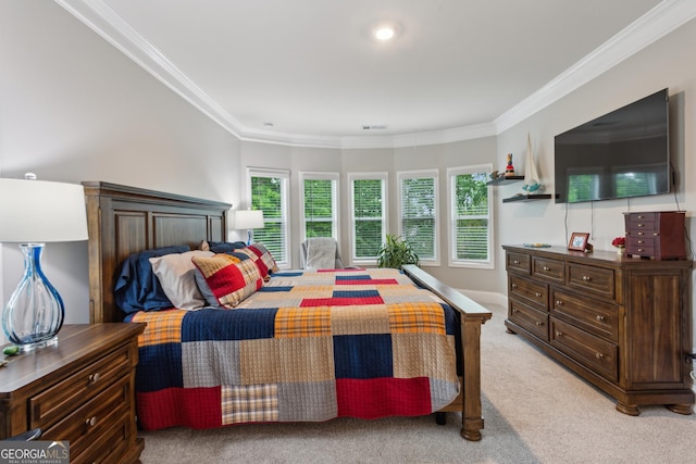bedroom featuring ornamental molding and light carpet
