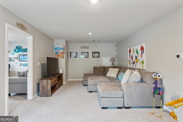 living area featuring carpet, baseboards, and recessed lighting